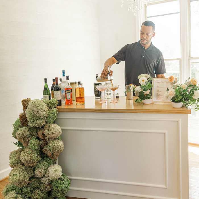 Bartender pouring cocktails